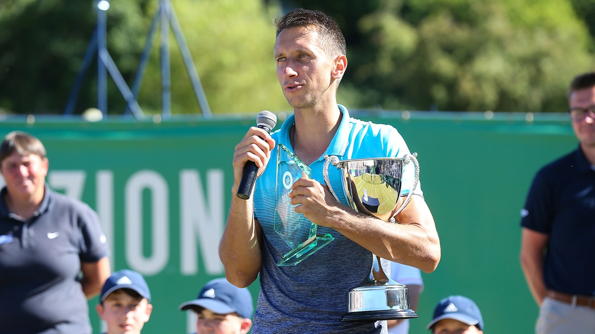 ILKLEY, ENGLAND - JUNE 24: Sergiy Stakhovsky of the Ukraine speaks to crowd after winning the final against Oscar Otte of Germany on day Eight of the Fuzion 100 Ikley Trophy at Ilkley Lawn Tennis & Squash Club on June 24, 2018 in Ilkley, United Kingdom. (Photo by Barrington Coombs/Getty Images for LTA)