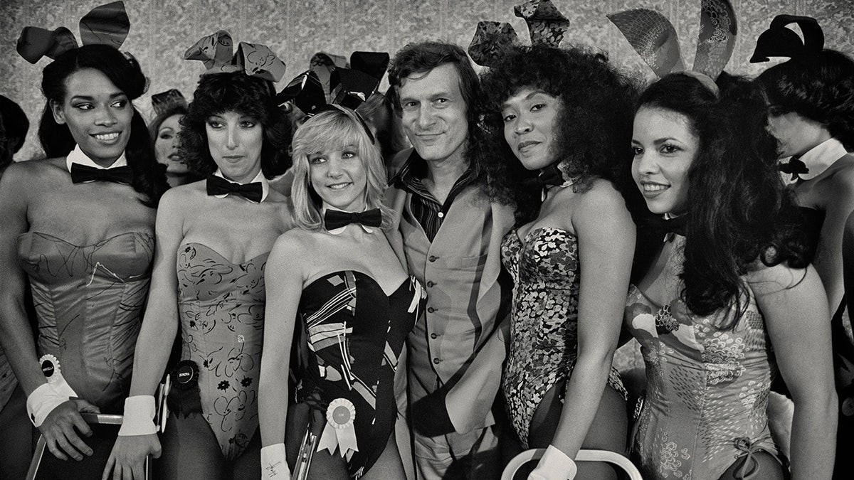 Hugh Hefner with a group of Playboy Bunnies at the Grand Opening of the Playboy Hotel-Casino in Atlantic City, New Jersey, USA,1981