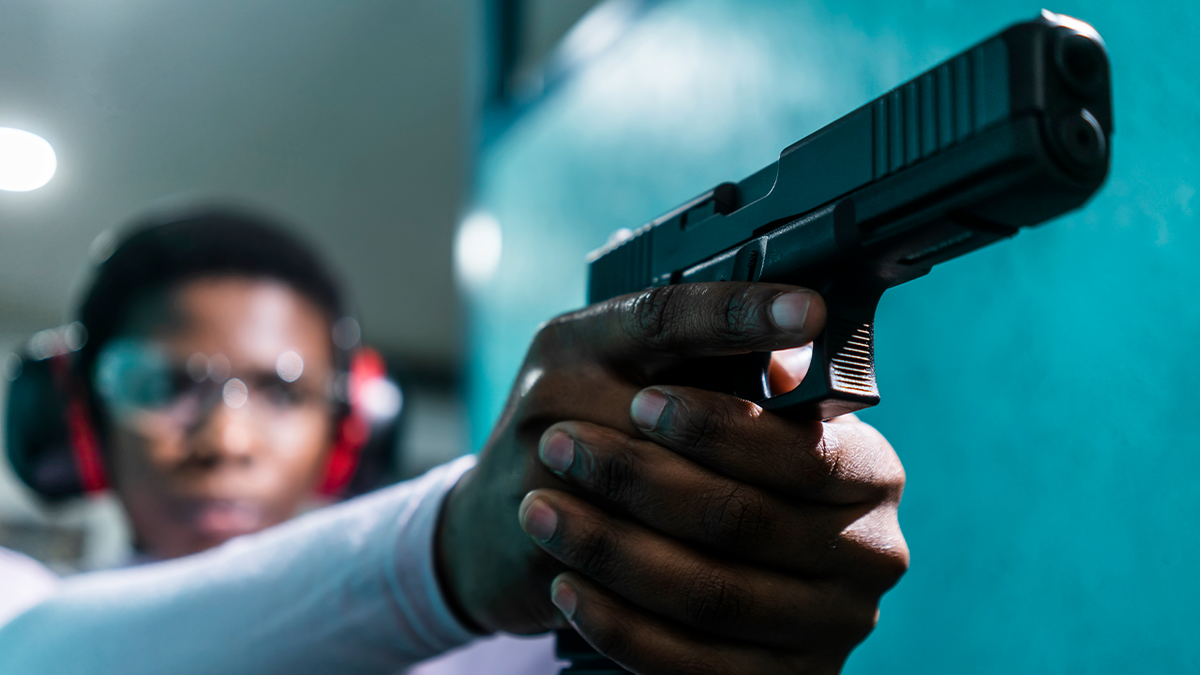 Woman at shooting range (istock)