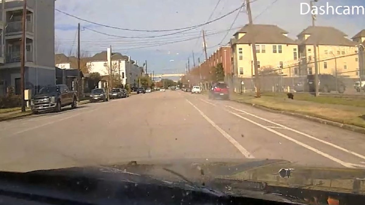 Bullets hit a Houston police vehicle during a Jan. 27 shootout between officers and a carjacking suspect, according to footage released by authorities. 