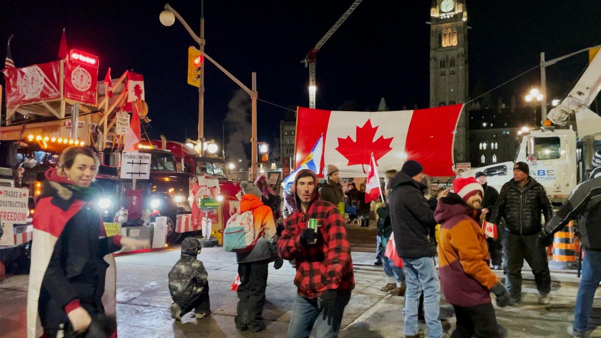 Protesters dance outside of the Canadian Parliament on the 19th day of the Freedom Convoy in Ottawa 