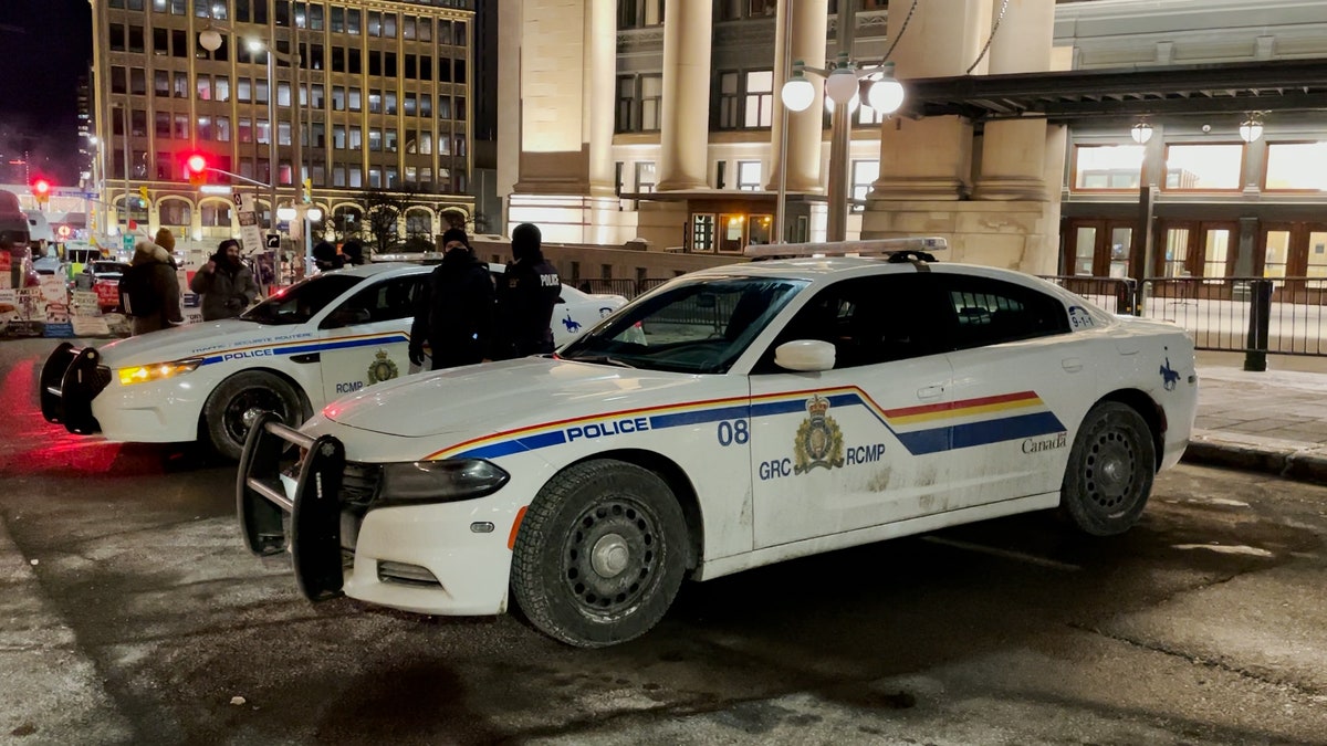 Police stand outside near the Parliament of Canada