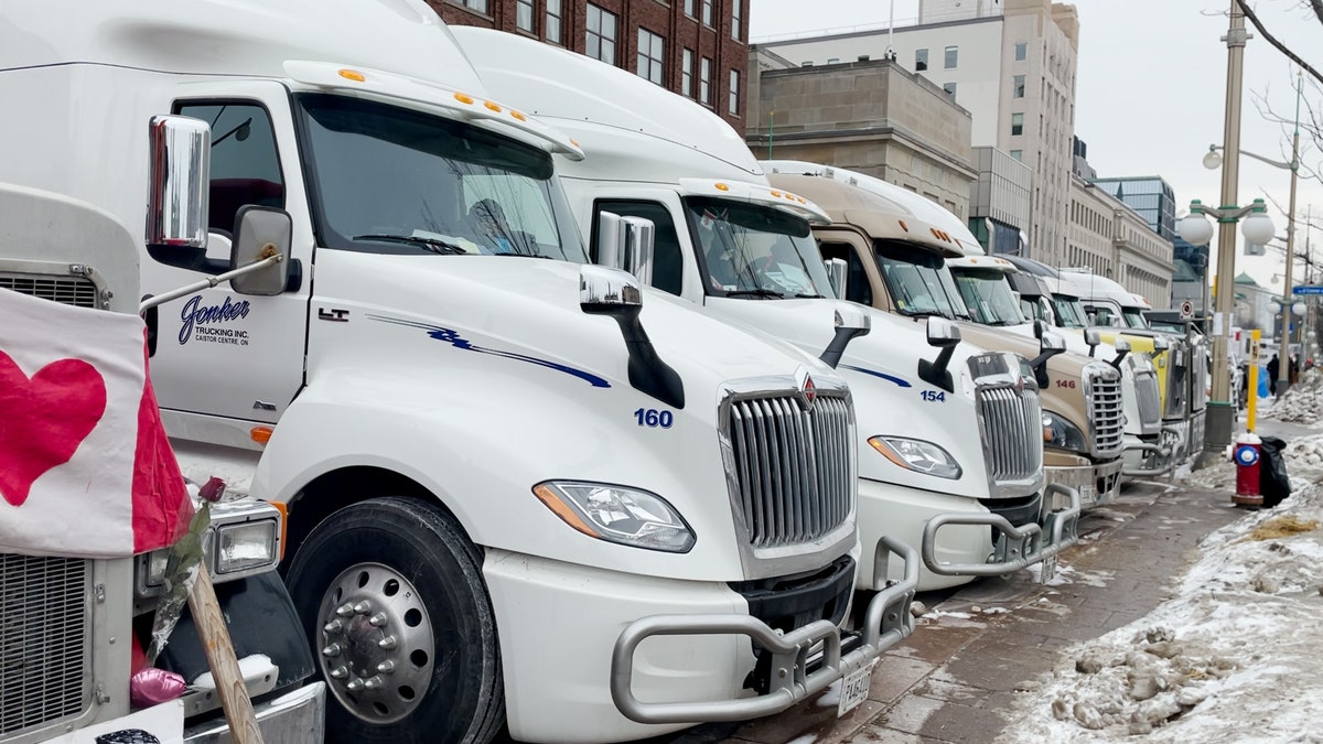 Trucks line the street directly outside the Parliament of Canada