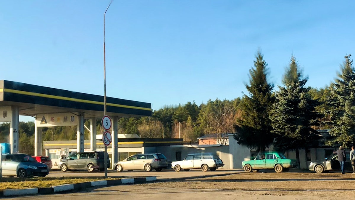 cars line up outside gas stations in Ukraine