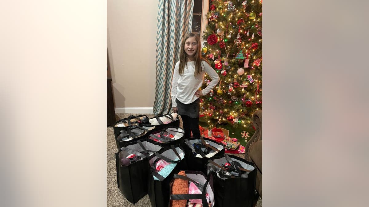 Sophie Enderton poses with chemo comfort bags