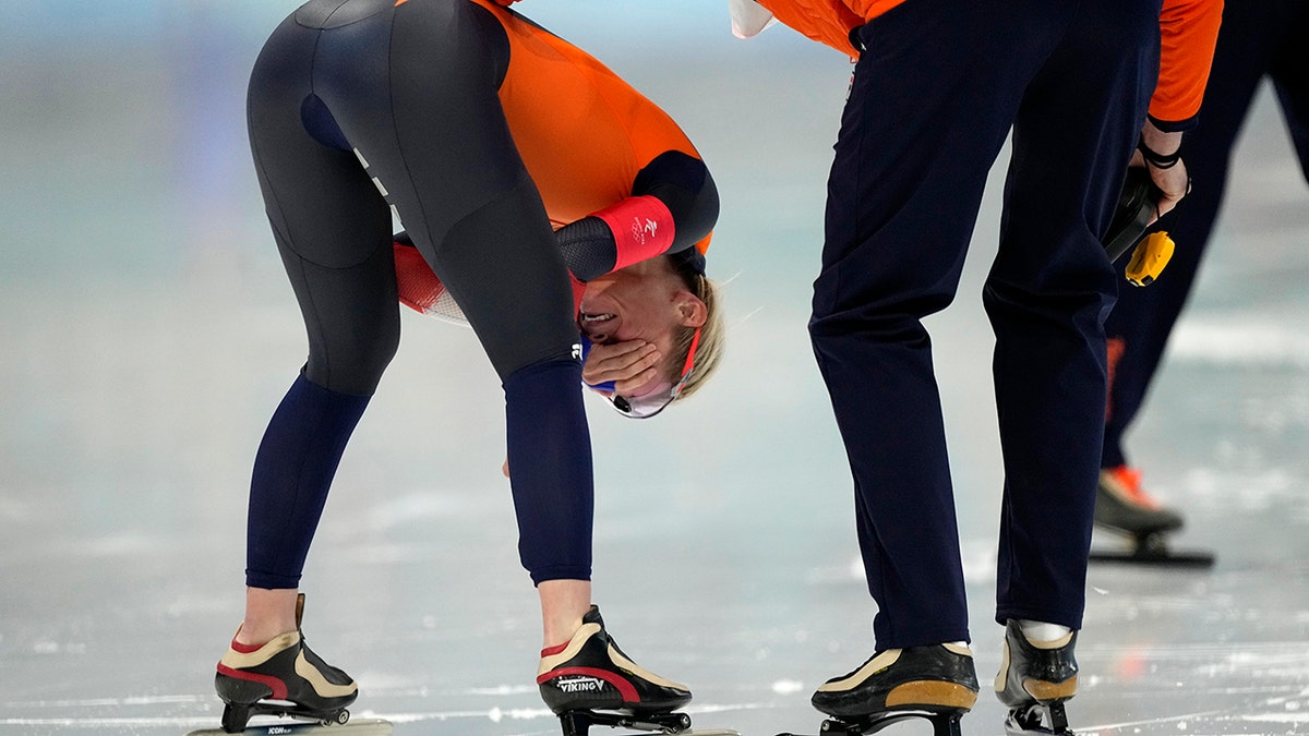 Irene Schouten of the Netherlands reacts after winning the gold medal and breaking the Olympic record in the women's speedskating 3,000-meter race at the 2022 Winter Olympics, Saturday, Feb. 5, 2022, in Beijing.