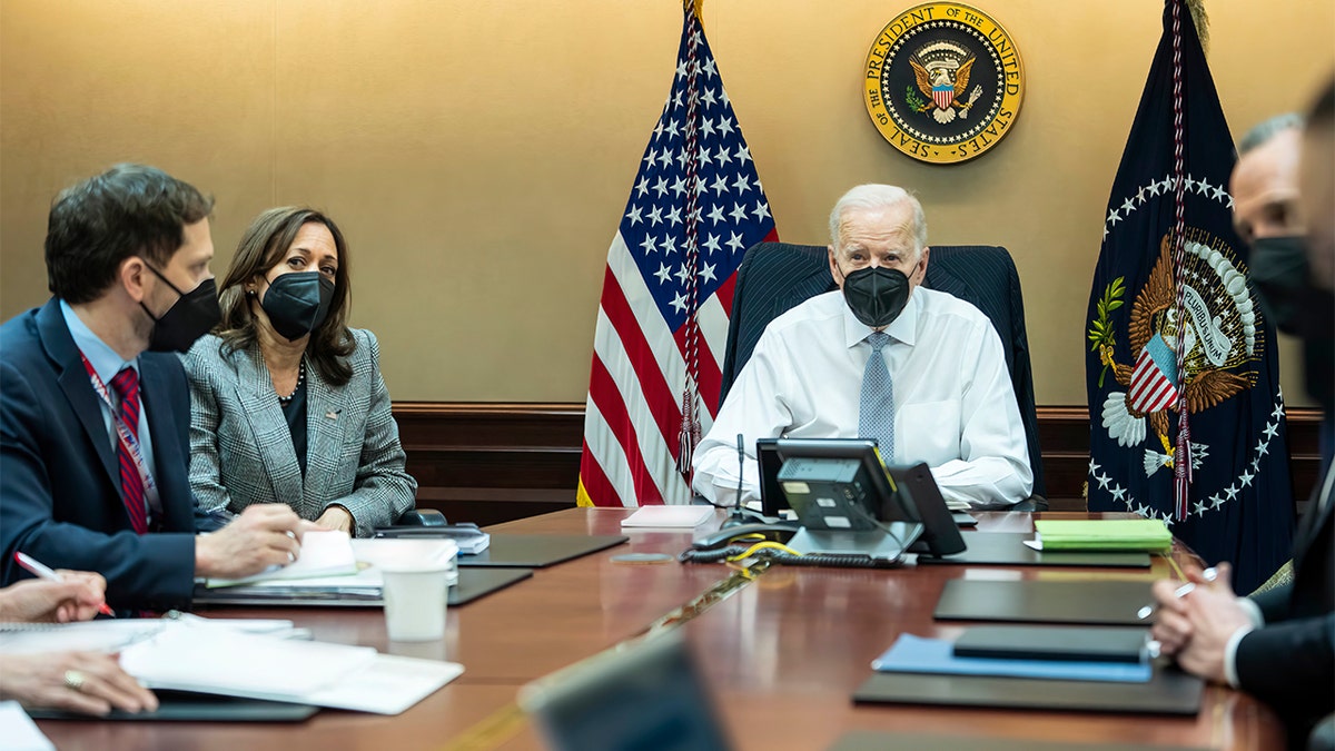In this image provided by The White House, President Biden and Vice President Kamala Harris and members of the President's national security team observe from the Situation Room at the White House in Washington, on Wednesday, Feb. 2, 2022, the counterterrorism operation responsible for removing from the battlefield Abu Ibrahim al-Hashimi al-Qurayshi, the leader of the Islamic State group. (Adam Schultz/The White House via AP)