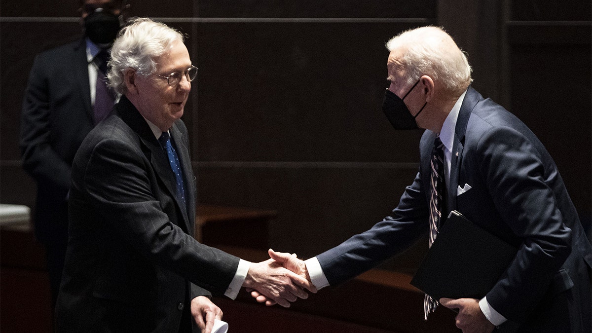 President Biden works with Mitch McConnell