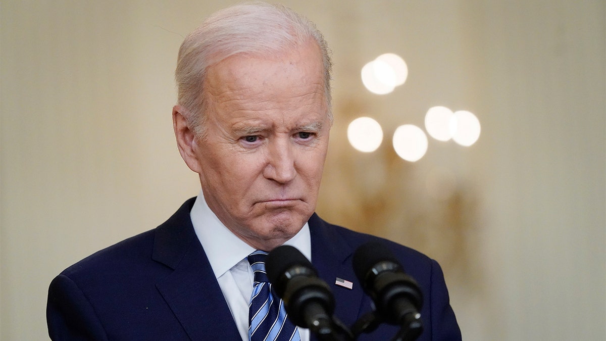 photo of Joe Biden talking to reporters