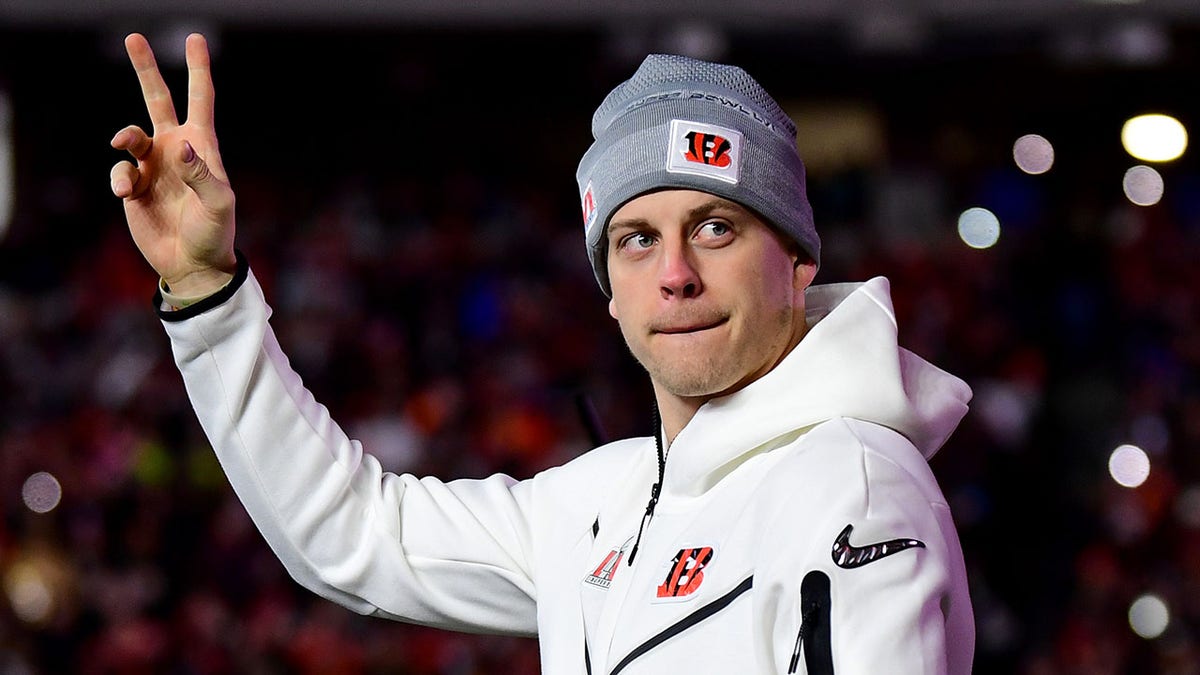 Joe Burrow #9 of the Cincinnati Bengals walks onto the field as he is introduced during a Cincinnati Bengals Fan Rally ahead of Super Bowl LVI at Paul Brown Stadium on Feb. 7, 2022 in Cincinnati, Ohio.