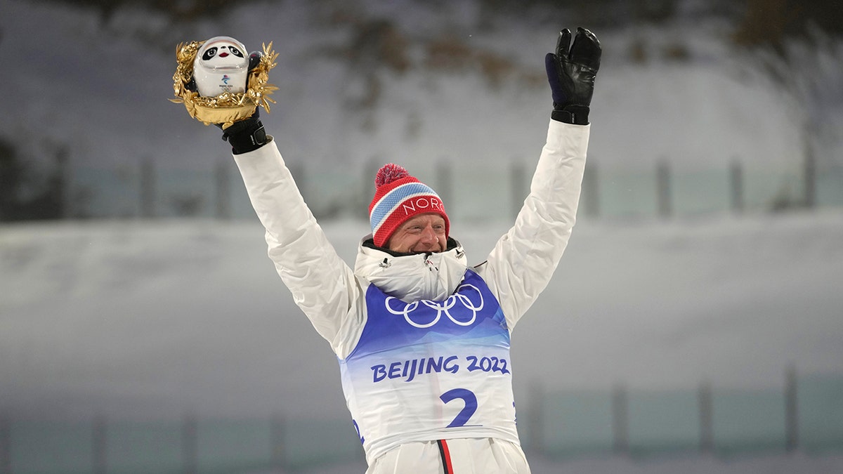 Johannes Thingnes Boe of Norway poses during the venue ceremony after the men's 15-kilometer mass start biathlon at the 2022 Winter Olympics, Friday, Feb. 18, 2022, in Zhangjiakou, China.