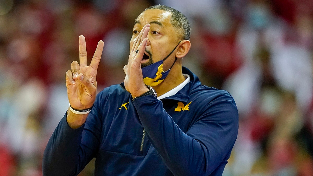 Michigan head coach Juwan Howard directs his team during the first half of an NCAA college basketball game against Wisconsin Sunday, Feb. 20, 2022, in Madison, Wis. Wisconsin won 77-63.