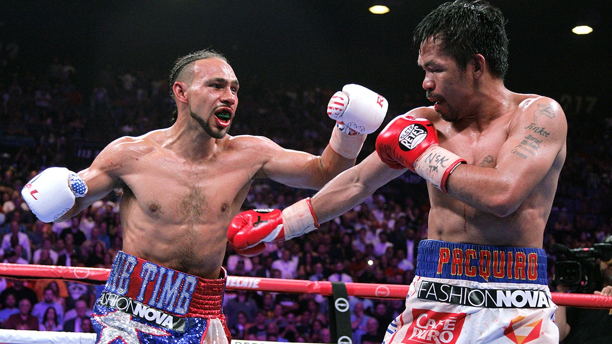 Filipino boxer Manny Pacquiao (R) and U.S. boxer Keith Thurman during their WBA super world welterweight title fight at the MGM Grand Garden Arena on July 20, 2019, in Las Vegas, Nevada.