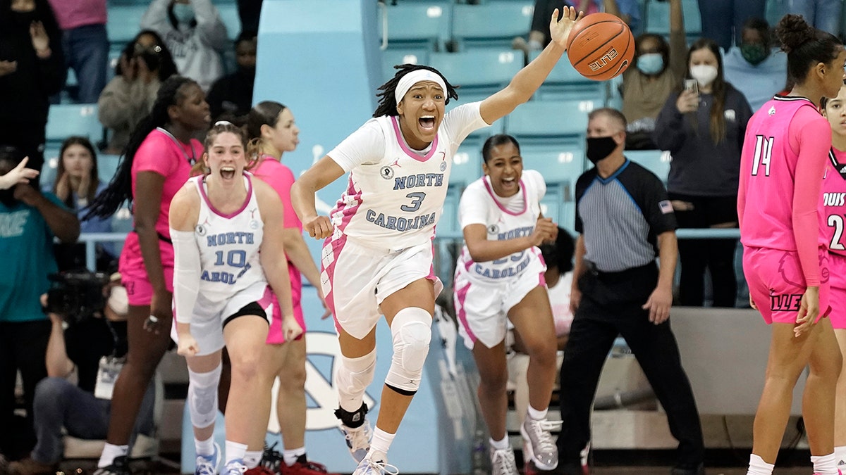 North Carolina guard Kennedy Todd-Williams (3) celebrates as time expires in an NCAA college basketball game against Louisville in Chapel Hill, N.C., Thursday, Feb. 17, 2022.