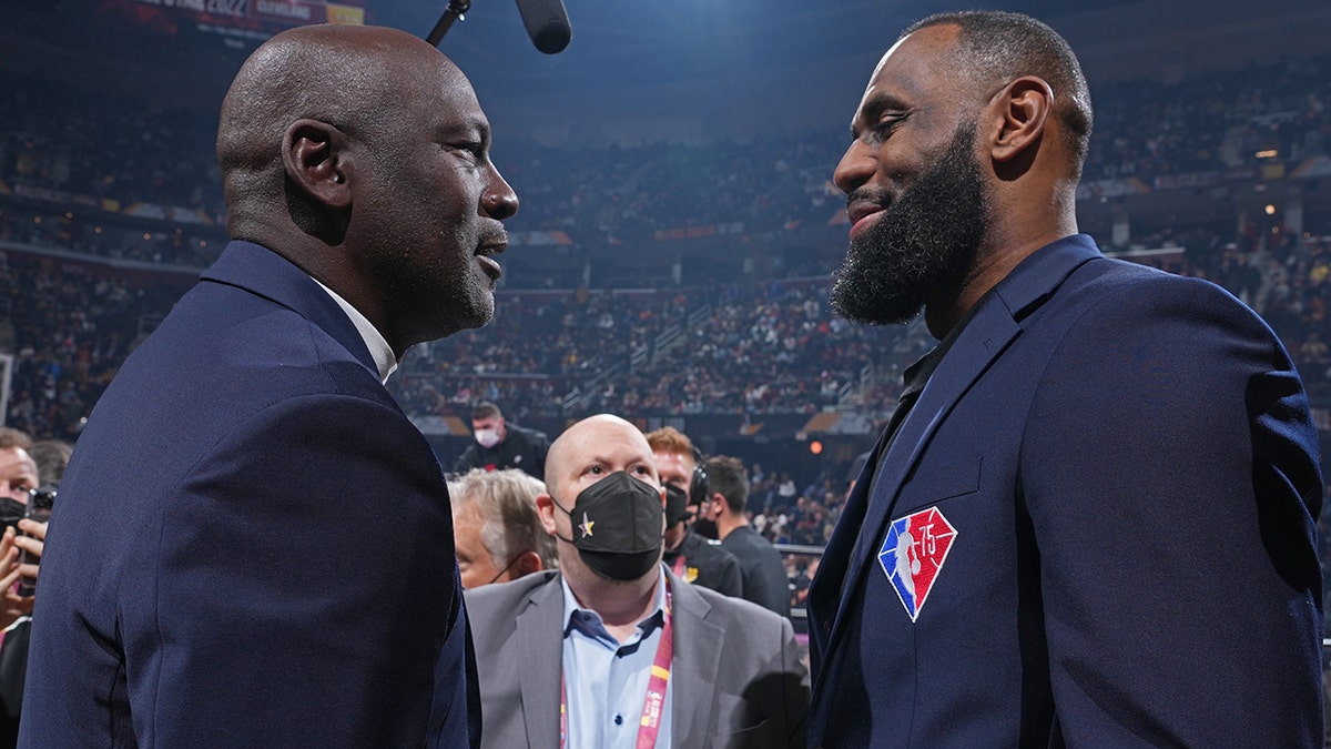 NBA Legends, Michael Jordan and LeBron James shake hands during the 2022 NBA All-Star Game as part of 2022 NBA All Star Weekend on February 20, 2022 at Rocket Mortgage FieldHouse in Cleveland, Ohio.
