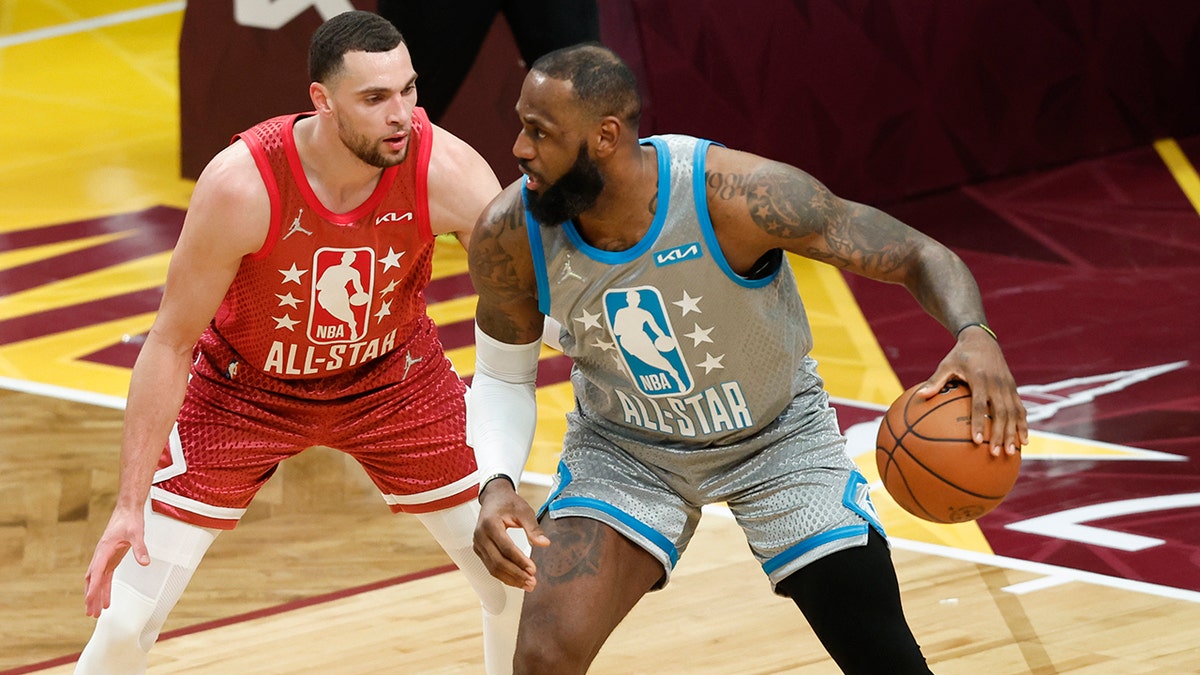 The Los Angeles Lakers' LeBron James looks to score as the Chicago Bulls' Zach LaVine defends during the second half of the NBA All-Star basketball game, Sunday, Feb. 20, 2022, in Cleveland.