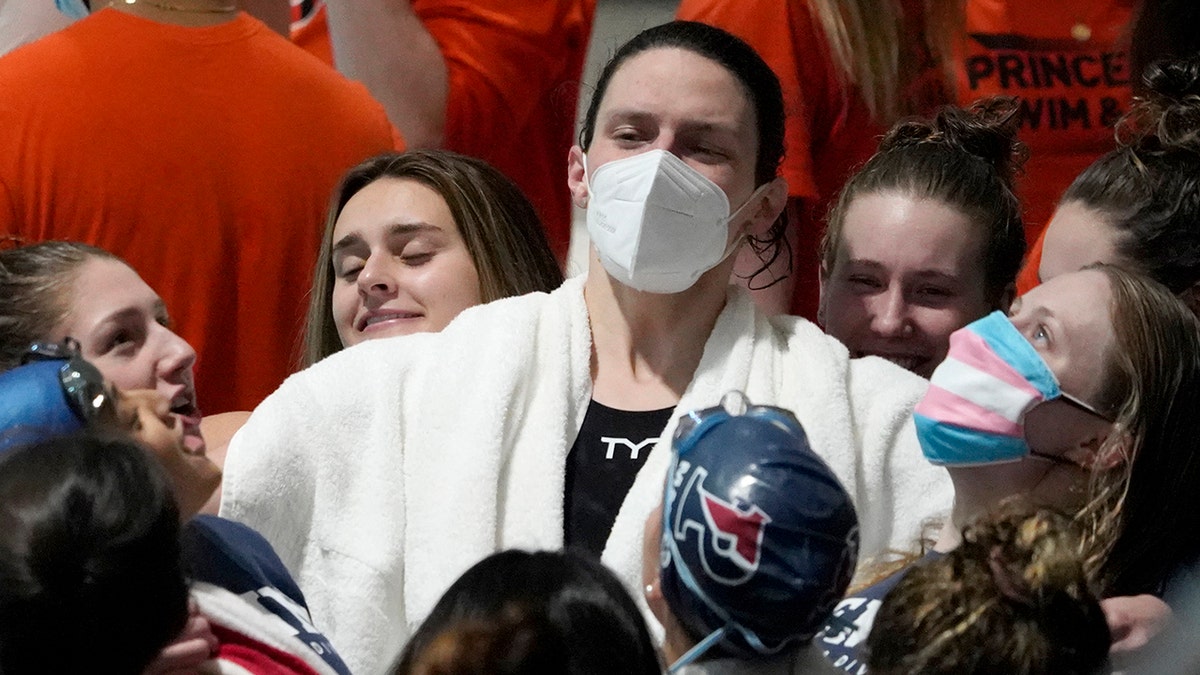 Penn's Lia Thomas leads the team in a cheer before the relay events at the Ivy League Women's Swimming and Diving Championships at Harvard University, Wednesday, Feb. 16, 2022, in Cambridge, Massachusetts.