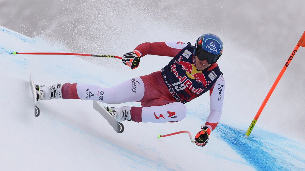 Austria's Matthias Mayer speeds down the course during an alpine ski, men's World Cup downhill, in Kitzbuehel, Austria, Sunday, Jan. 23, 2022.