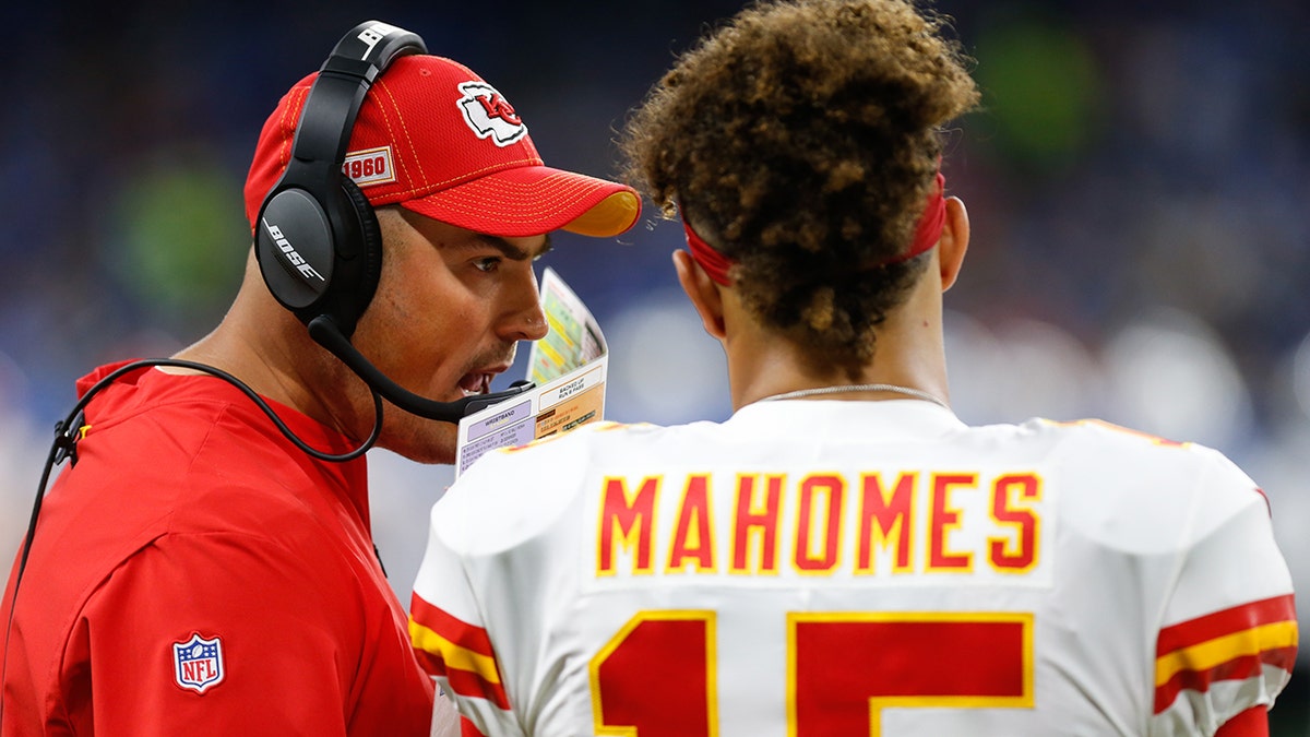 Kansas City Chiefs quarterbacks coach Mike Kafka talks with Kansas City Chiefs quarterback Patrick Mahomes (15) during a regular season game between the Kansas City Chiefs and the Detroit Lions on September 29, 2019 at Ford Field in Detroit, Michigan.