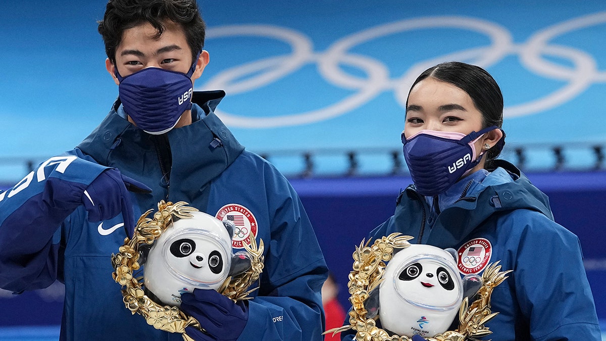 Silver medalists Karen Chen and Nathan Chen pose for a photo after the team event in the figure skating competition at the 2022 Winter Olympics, Monday, Feb. 7, 2022, in Beijing.