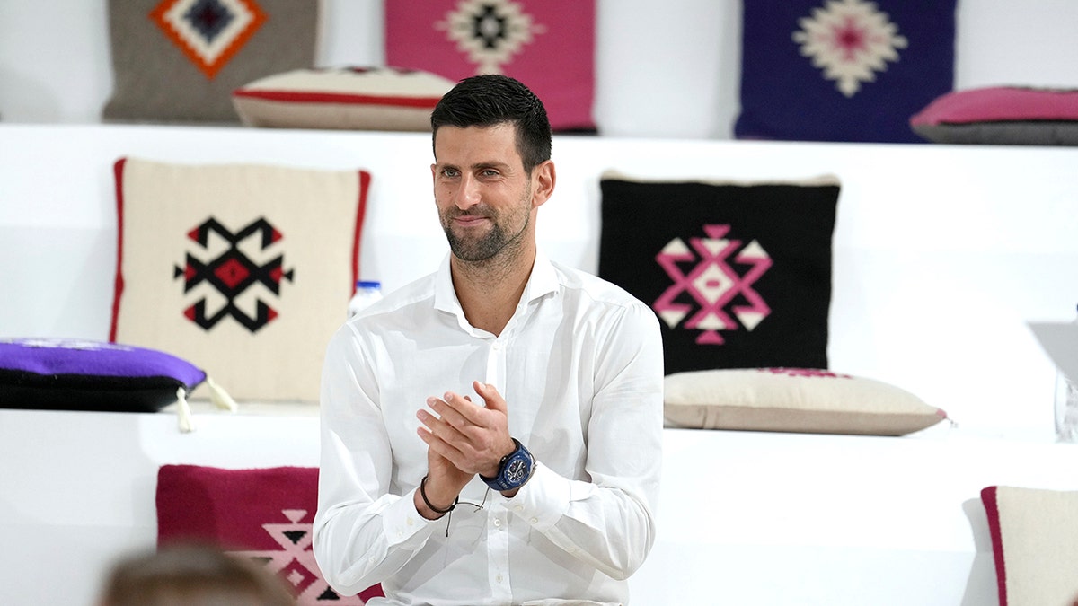Serbian tennis star Novak Djokovic claps during a presentation of the Novak Djokovic Foundation in the Serbian pavilion at Dubai Expo 2020, in Dubai, United Arab Emirates, Thursday, Feb. 17, 2022. Djokovic on Thursday received a warm welcome in Dubai, where he visited the world's fair following the global drama around his decision to remain unvaccinated.