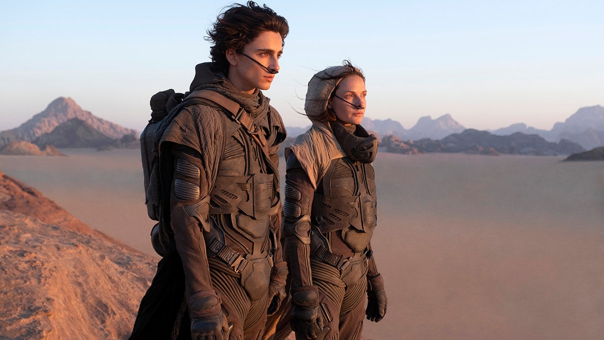This image released by Warner Bros. Pictures shows Timothee Chalamet, left, and Rebecca Ferguson in a scene from "Dune."