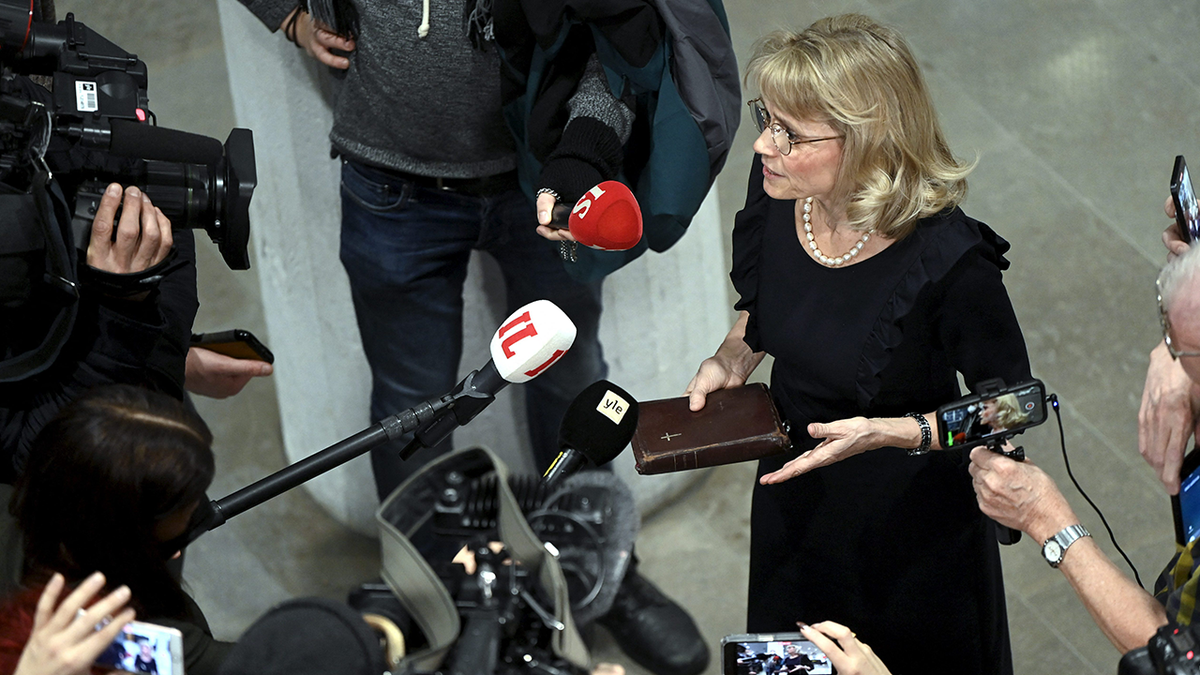 Paivi Rasanen holds Bible