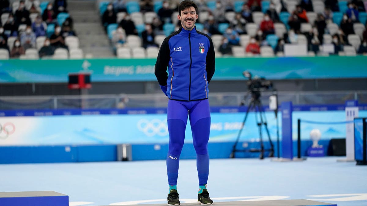 Bronze medalist Davide Ghiotto of Italy smiles during a venue ceremony in the men's speedskating 10,000-meter race at the 2022 Winter Olympics, Friday, Feb. 11, 2022, in Beijing.