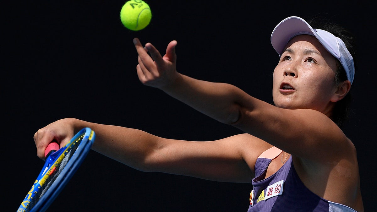 FILE - China's Peng Shuai serves to Japan's Nao Hibino during their first round singles match at the Australian Open tennis championship in Melbourne, Australia, on Jan. 21, 2020. (AP Photo/Andy Brownbill, File)