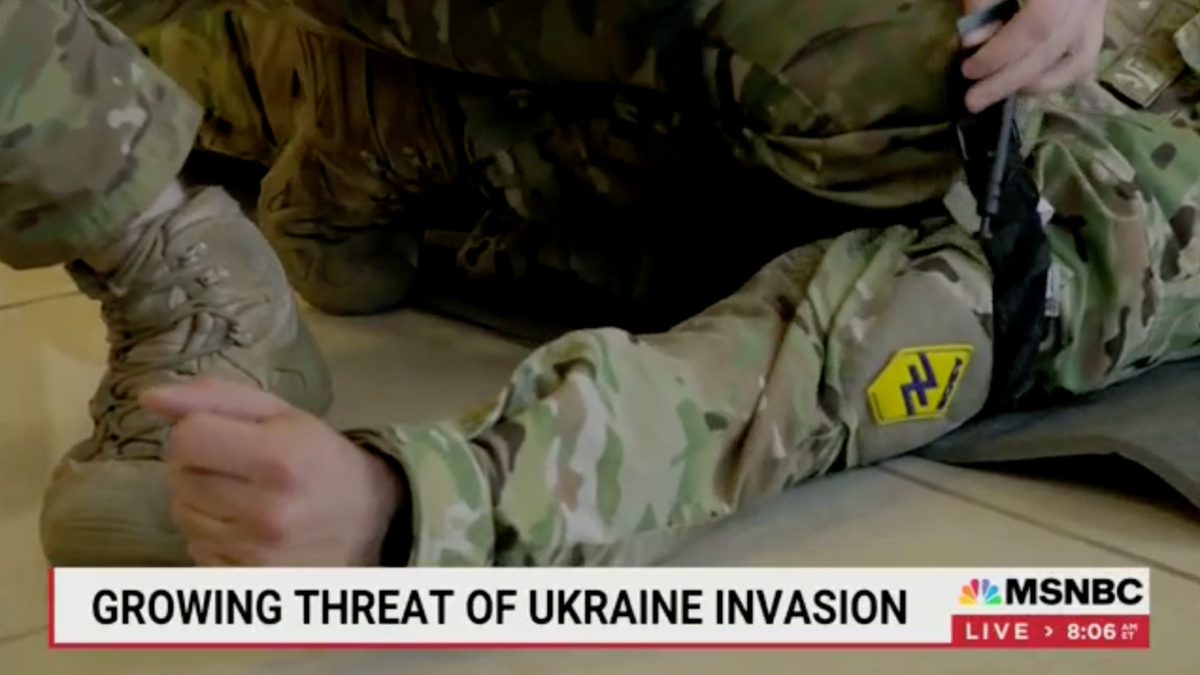 The Azov Battalion insignia featured on the uniforms of Ukrainian militants training civilians for a potential Russian invasion, as featured in an MSNBC report.