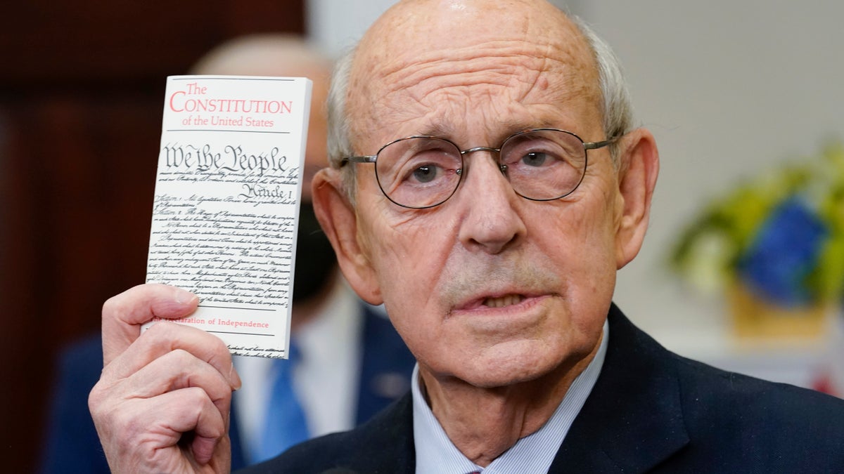 Supreme Court Associate Justice Stephen Breyer holds US Constitution