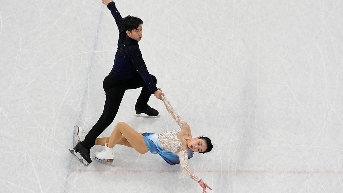 Sui Wenjing and Han Cong, of China, compete in the pairs free skate program during the figure skating competition at the 2022 Winter Olympics, Saturday, Feb. 19, 2022, in Beijing.