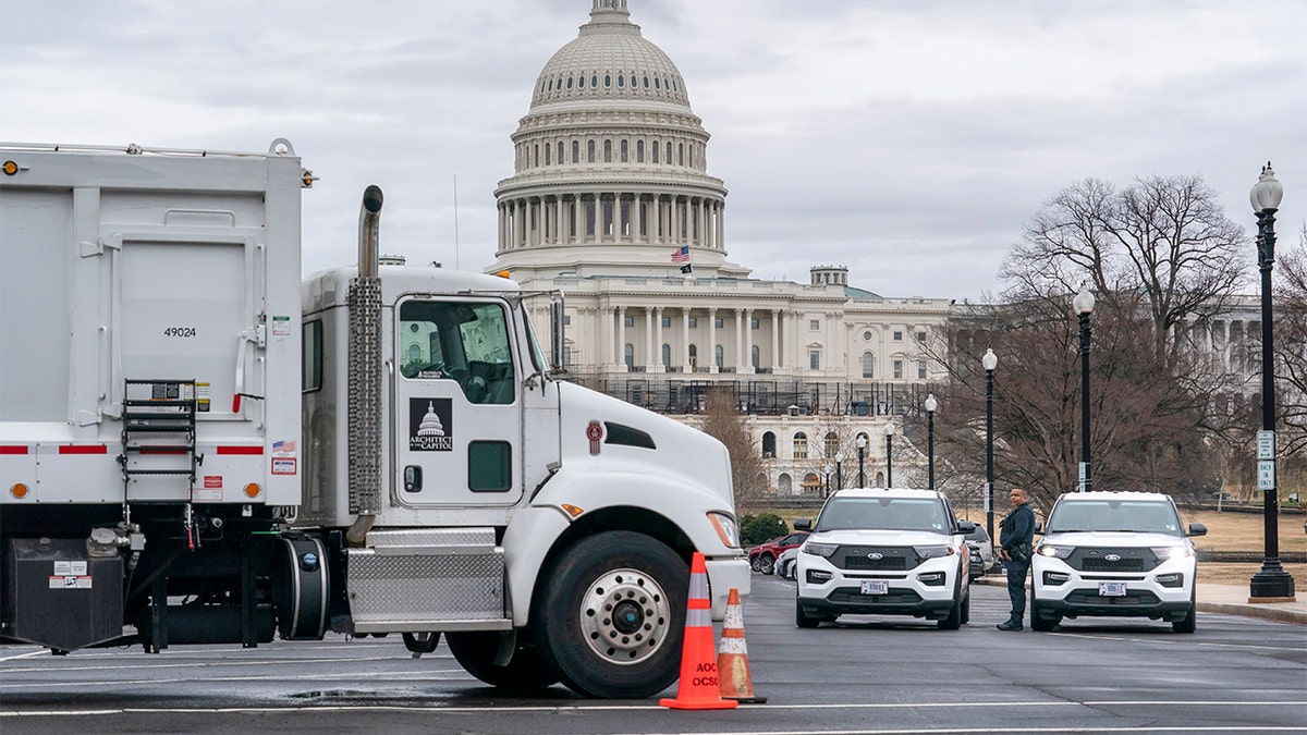 Criminals who crashed stolen car into Capitol barricade captured, had automatic-capable gun: police Trucks in front of U.S. Capitol