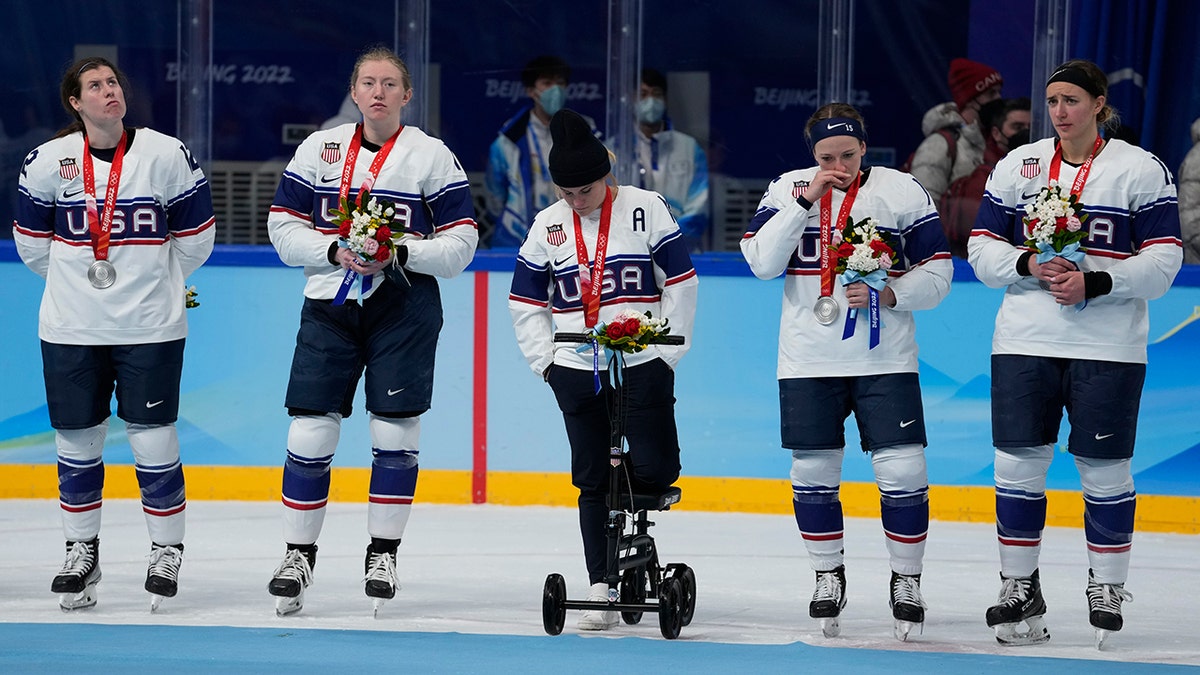 United States pose for photos after receiving their silver medals after being defeated by Canada in women's gold medal hockey game at the 2022 Winter Olympics, Thursday, Feb. 17, 2022, in Beijing.