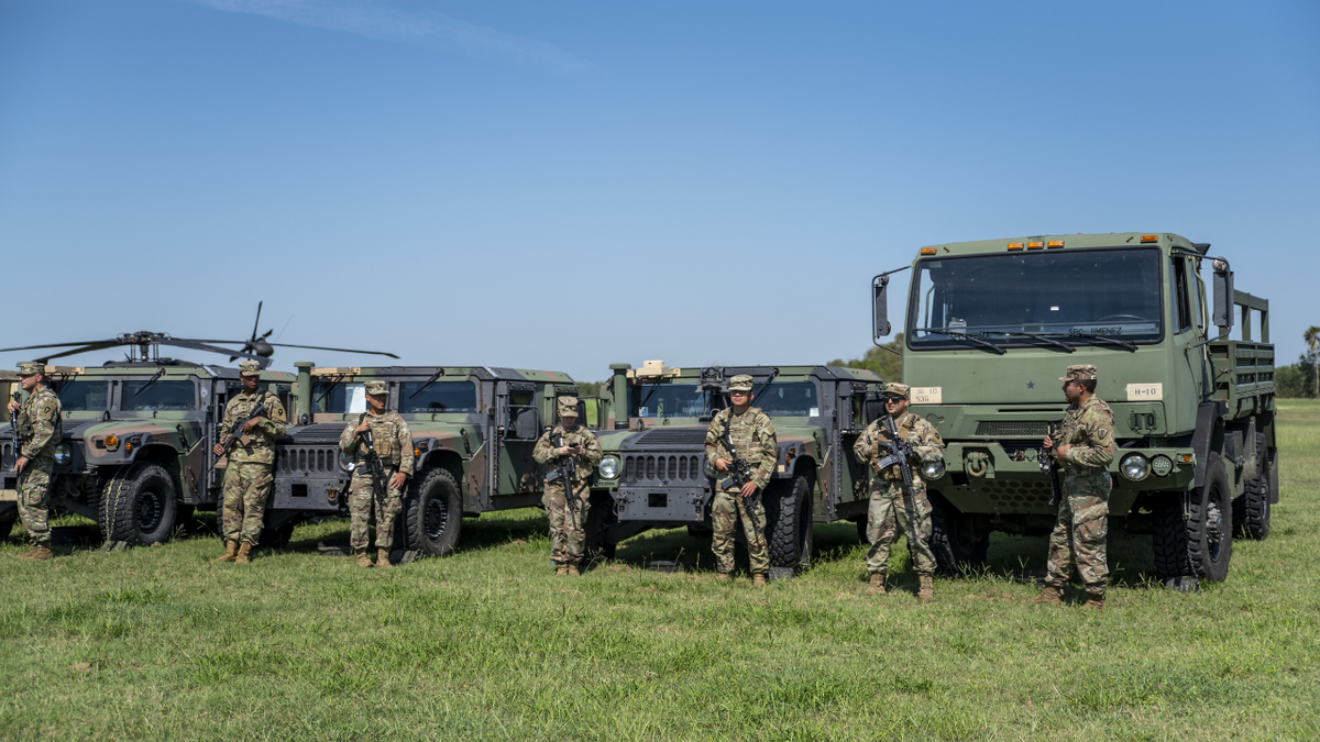 Members of the Texas National Guard during a news conference with Greg Abbott, governor of Texas, not pictured, in Mission, Texas, U.S., on Wednesday, Oct. 6, 2021. 