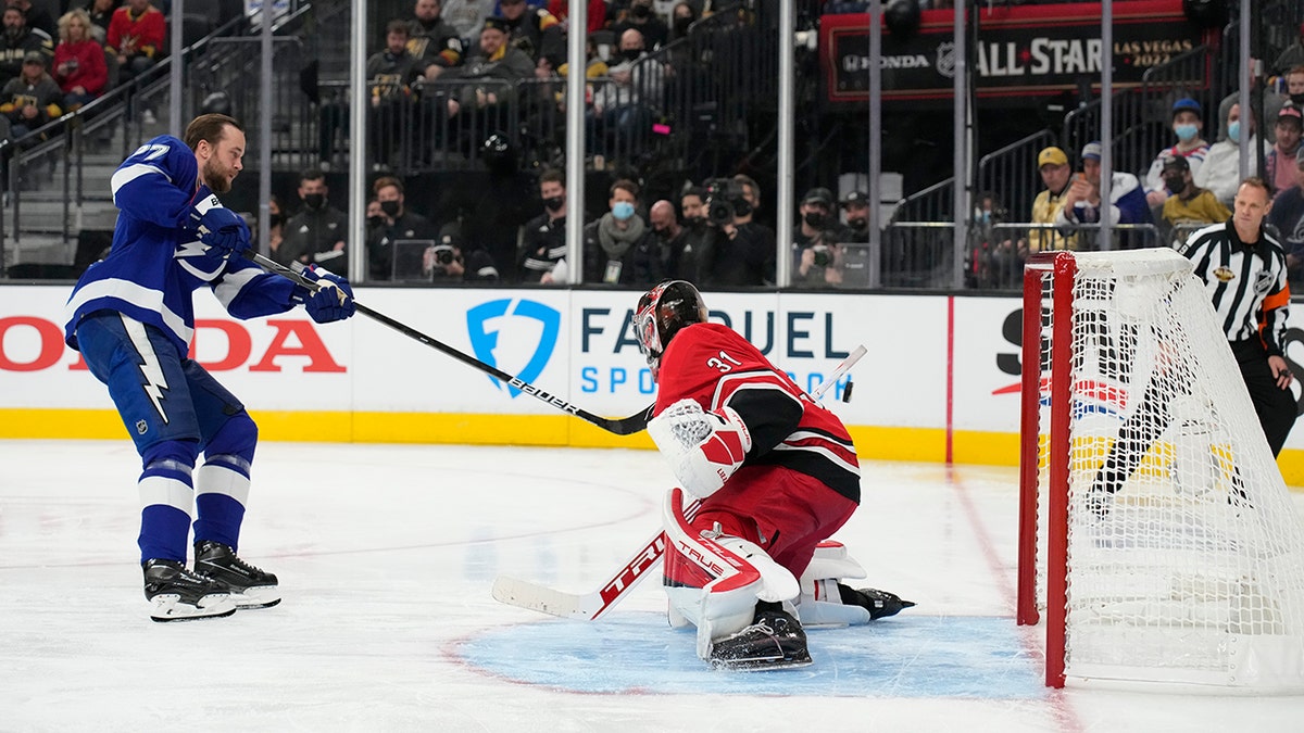 Tampa Bay Lightning's Victor Hedman, left, and Carolina Hurricanes goalie Frederik Andersen participate in the Skills Competition save streak event, part of the NHL All-Star weekend, Friday, Feb. 4, 2022, in Las Vegas.