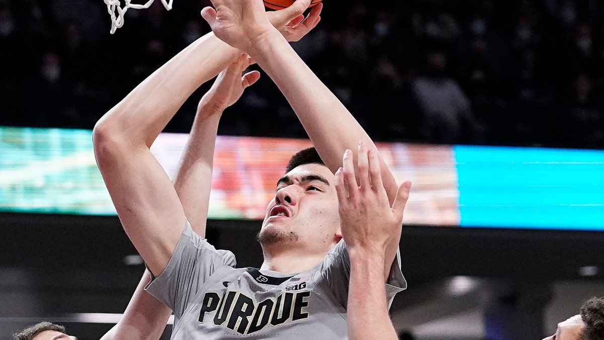 Purdue center Zach Edey, center, goes up for a shot against Northwestern forward Robbie Beran, left, and forward Pete Nance during the first half of an NCAA college basketball game in Evanston, Ill., Wednesday, Feb. 16, 2022.