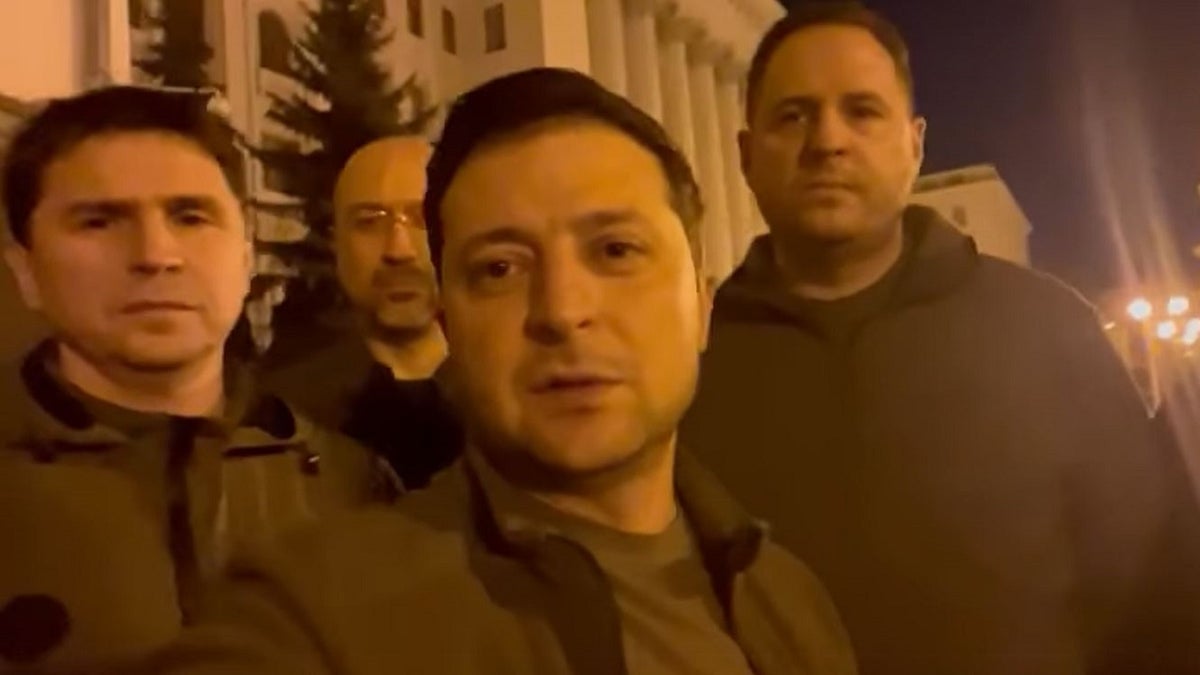 Ukrainian President Volodymyr Zelenskyy stands alongside other government officials in a video posted to social media Friday vowing to defend the country from a Russian invasion. 