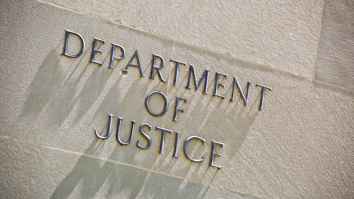 The entrance signage for the United States Department of Justice Building in Washington, DC. 