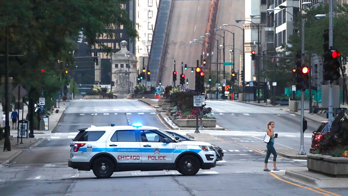 Michigan Avenue in Chicago is seen with a city police vehicle in the foreground, Aug. 10, 2020.