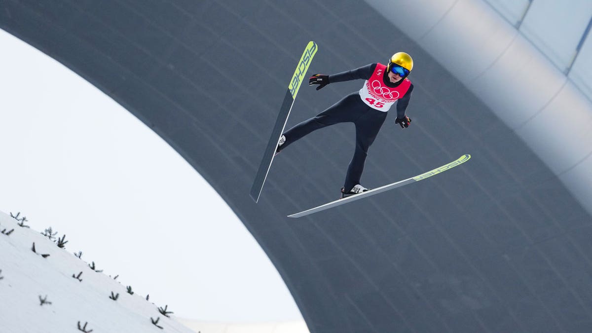 Vinzenz Geiger, of Germany, soars through the air during a trial round in the ski jump portion of the individual Gundersen normal hill event at the 2022 Winter Olympics, Wednesday, Feb. 9, 2022, in Zhangjiakou, China. 