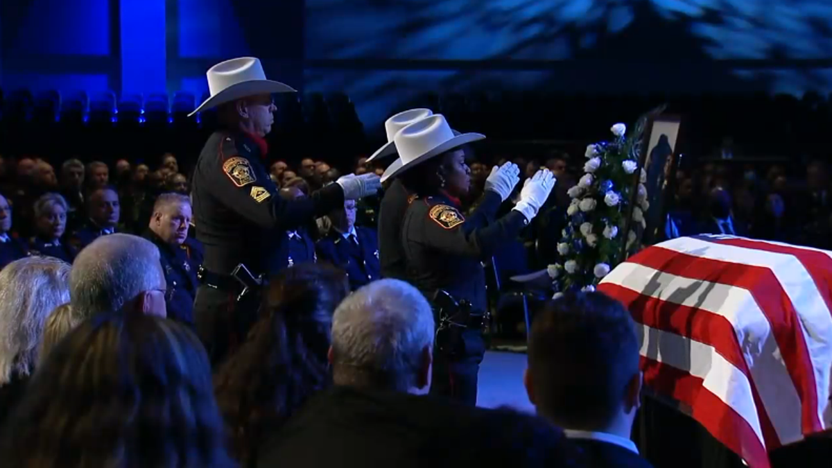 Harris County Cpl. Charles Galloway's casket saluted during funeral service at Second Baptist Church - West Campus, Houston. 