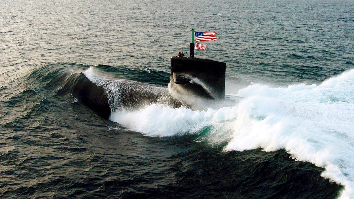 The USS Albuquerque SSN-706 participates in a photo-exercise Sept. 10, 2006 in the North Arabian Sea. The submarine in question is not pictured. 