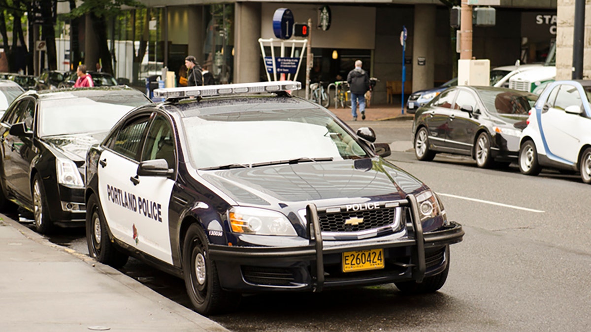 Portland, OR, USA - September 24, 2014:  A Portland Oregon police cruizer or car sits in the downtown area near the courthouse.