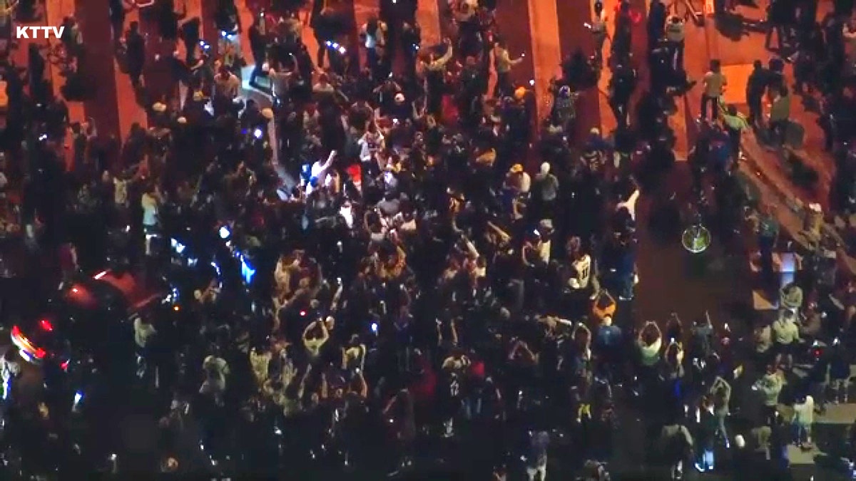Crowds in Los Angeles celebrating the Rams' victory in Super Bowl LVI.