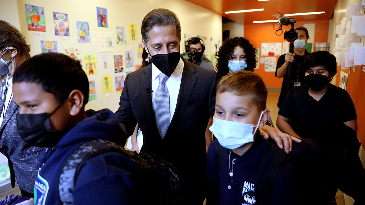 Superintendent Alberto M. Carvalho, Los Angeles Unifed School District, shown with students as he tours Maywood Center For Enriched Studies (MaCES) Magnet school on Wednesday, Feb. 16, 2022 in Maywood, CA. (Gary Coronado / Los Angeles Times via Getty Images)