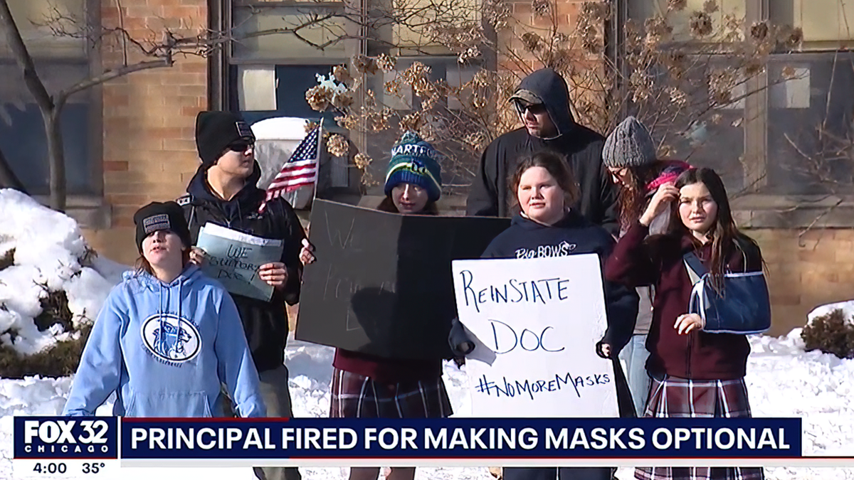 Parents and students held signs reading "Reinstate Doc" and "No More Masks."
