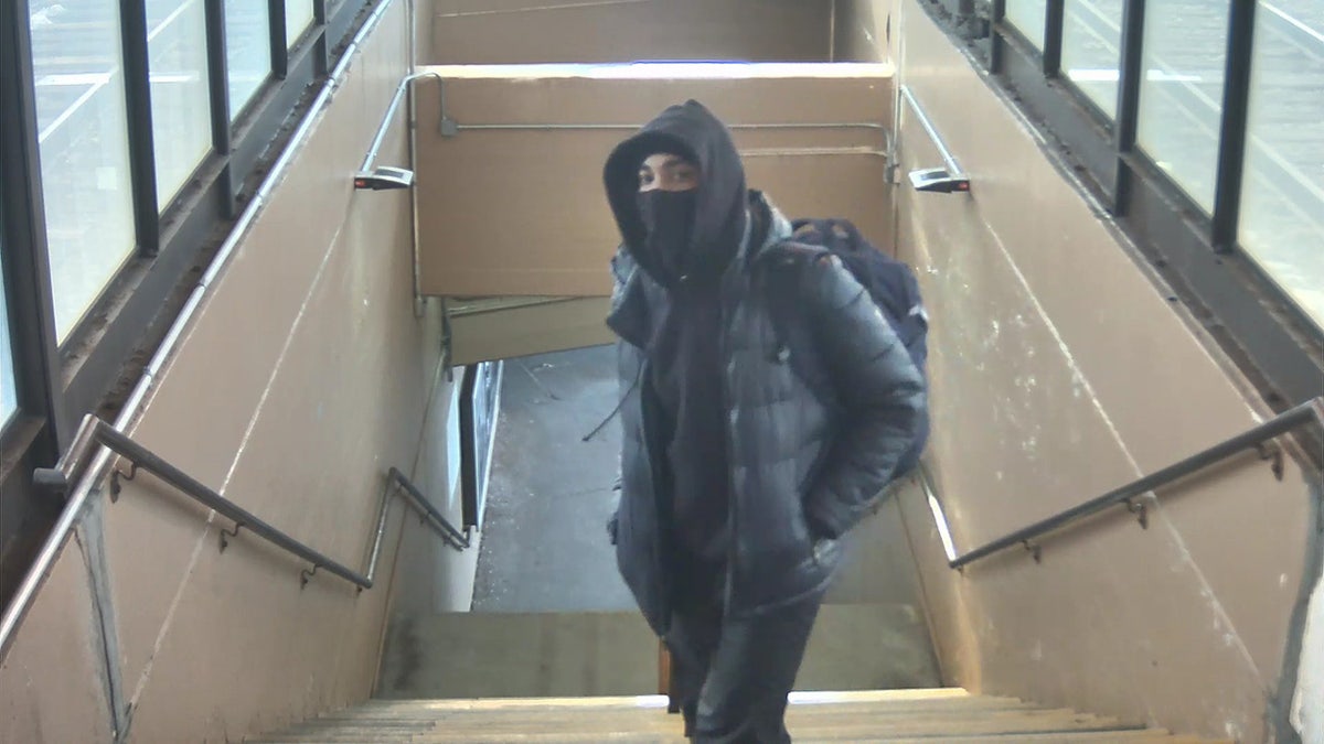 A masked Chicago man held a train conductor at gunpoint Tuesday during a broad daylight robbery at a downtown station stop, authorities said.