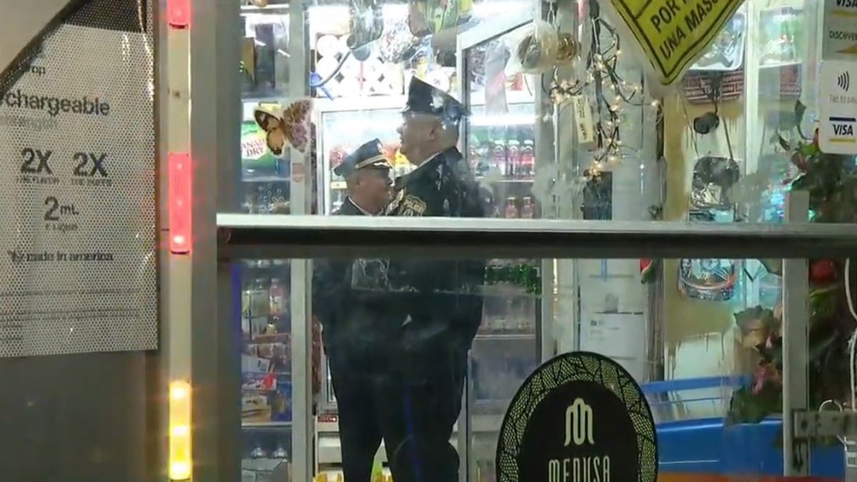 An armed Philadelphia store clerk in critical condition early Tuesday after she was wounded during a gun battle with two armed robbers, authorities said. 