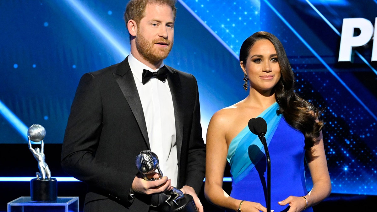 Prince Harry (L) and Meghan Markle, Duke and Duchess of Sussex, accept the President's Award at the 53rd NAACP Image Awards Show at The Switch on Saturday, February 26, 2022 in Burbank, California.